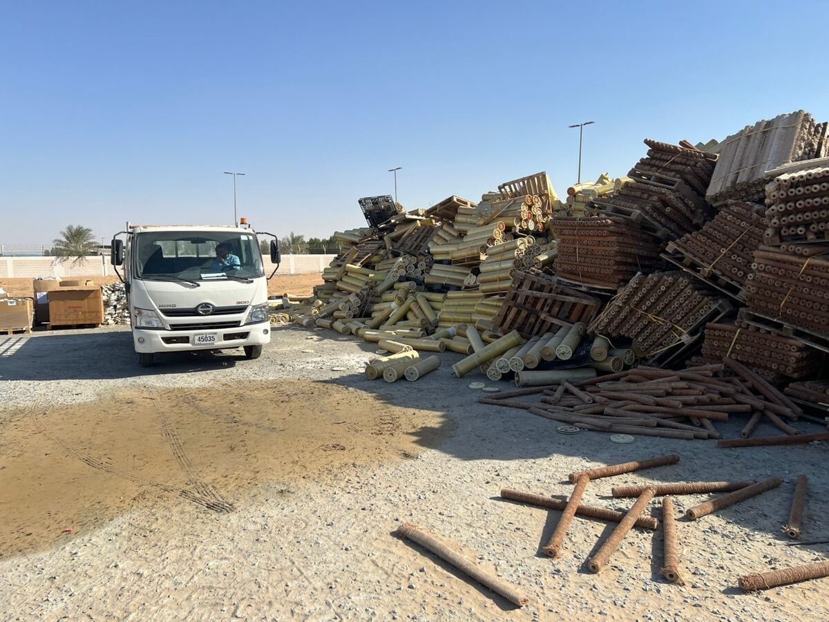 A tipper truck beside a dumped pile of spent RO membranes, the waste Second Life RO now buys